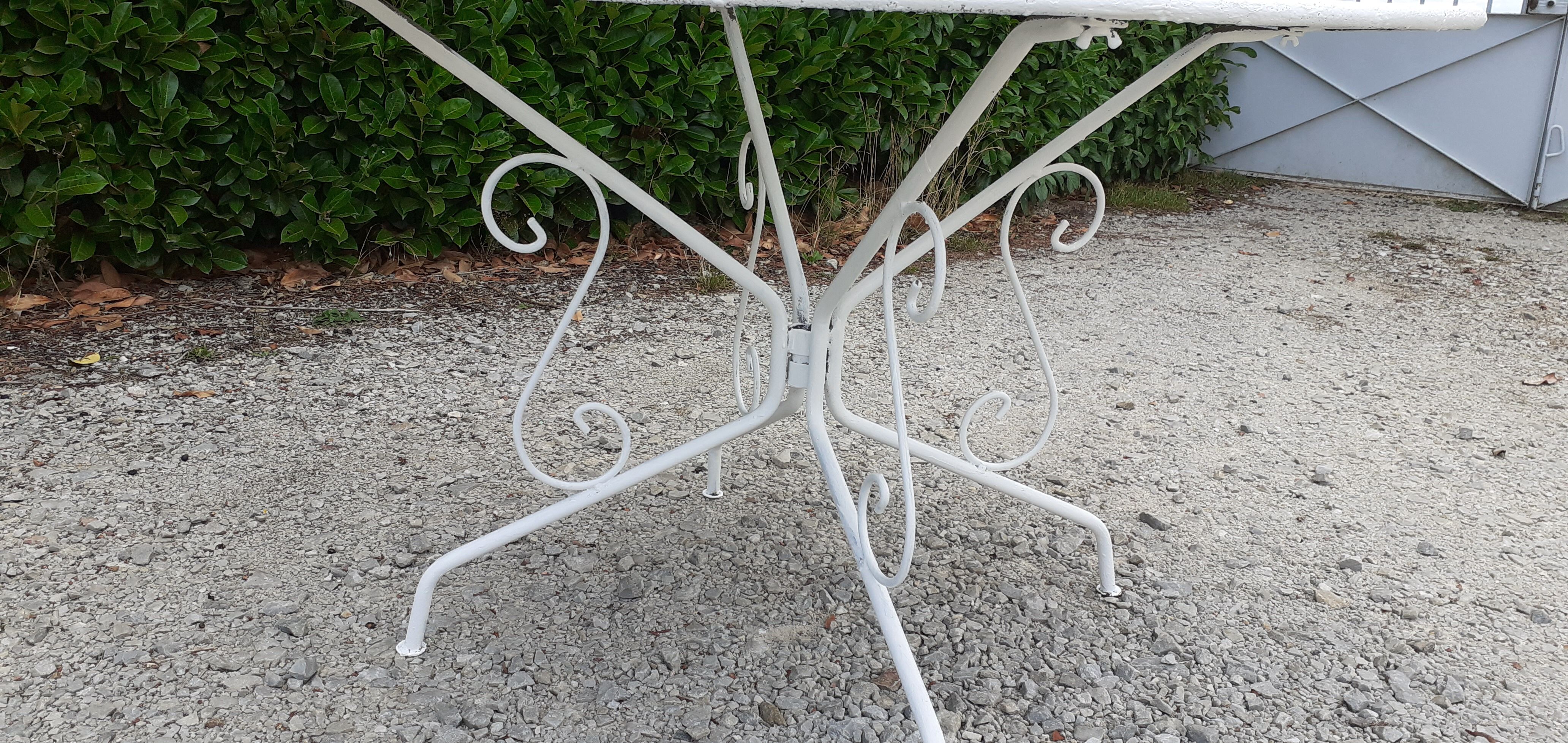 Old white wrought iron garden room