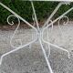 Old white wrought iron garden room