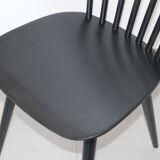 4 black Baumann V5 chairs