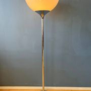 Guzzini Flash Space Age floor lamp with a chrome base and white acrylic shade.