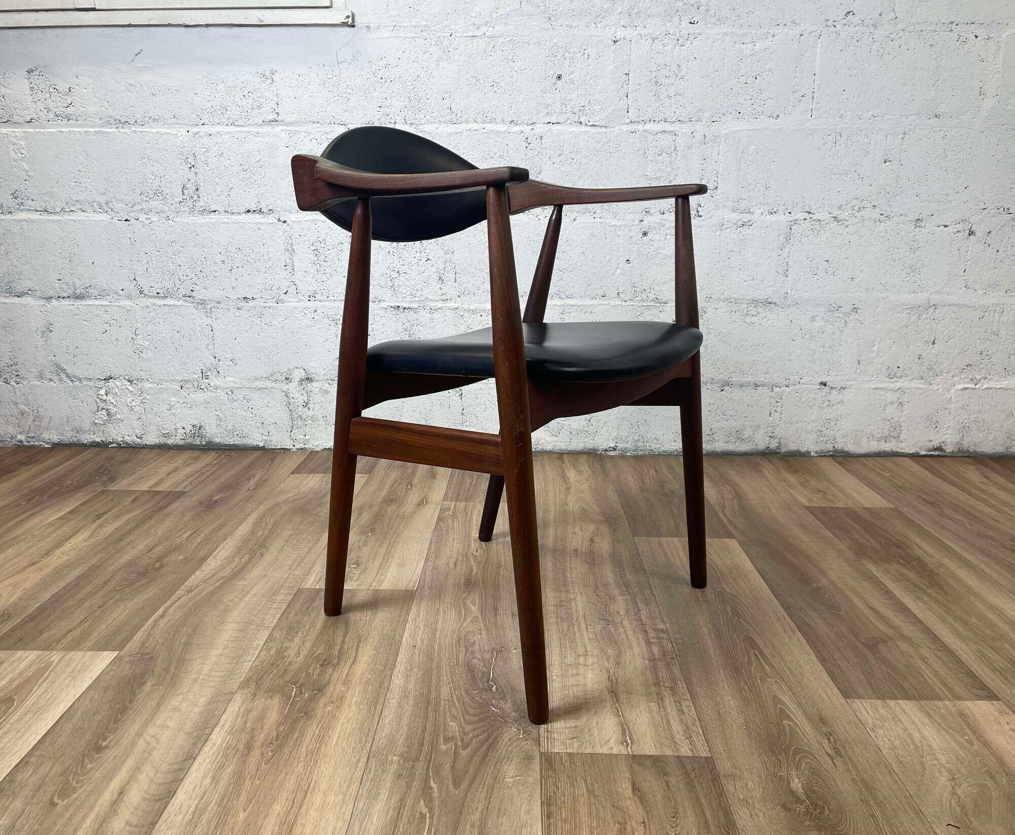 Vintage Scandinavian armchair in teak and black skai, 60s
