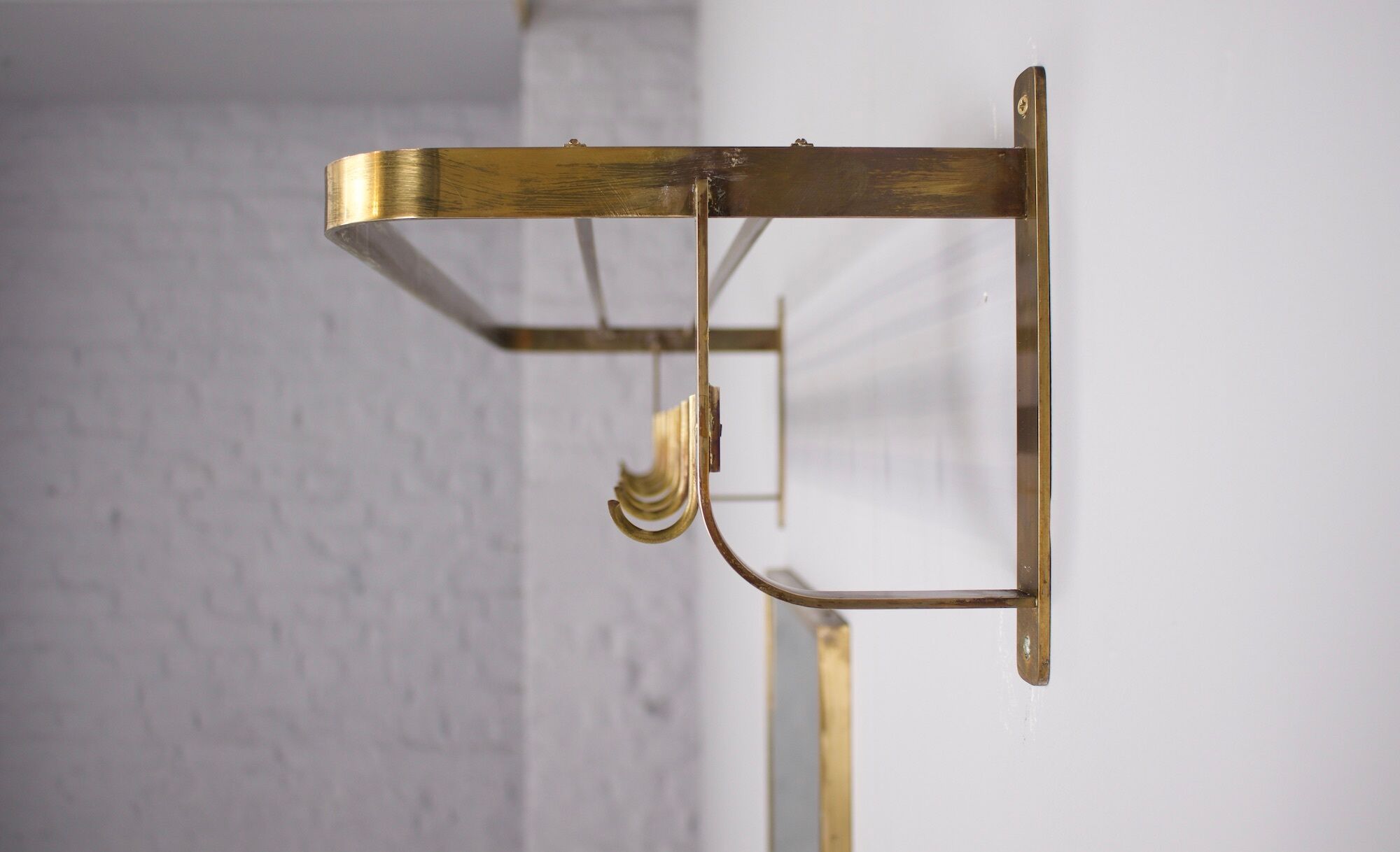 Vereinigte Werkstätten, brass cloakroom and mirror