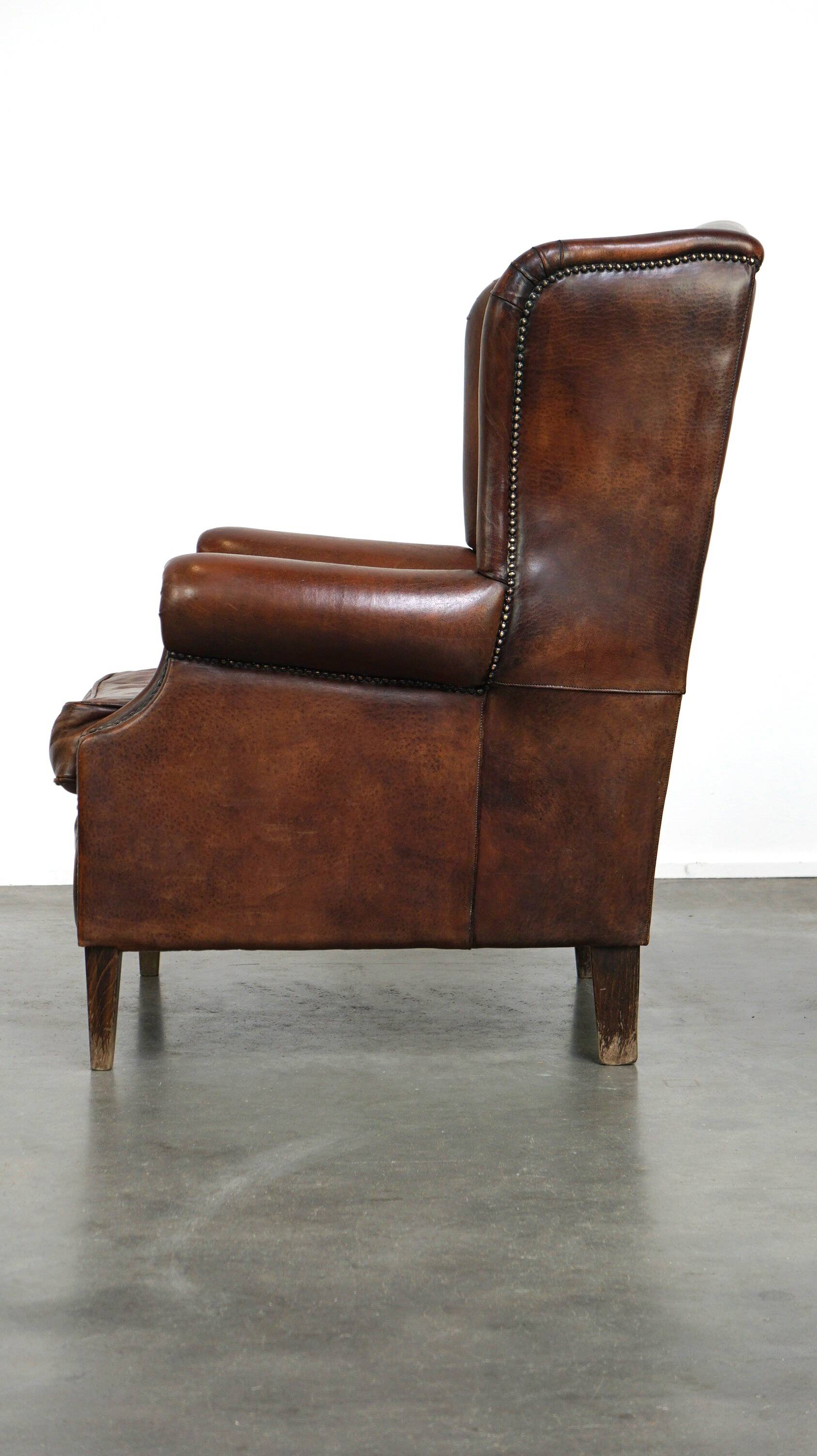 Large sheepskin wing chair with excellent colour and great seating comfort