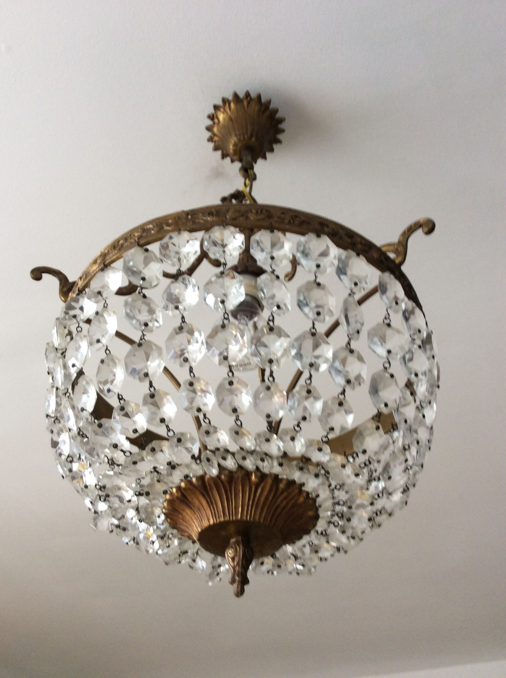 Old chandelier with bronze stamps