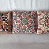 Set of three old hand-embroidered wool cushions
