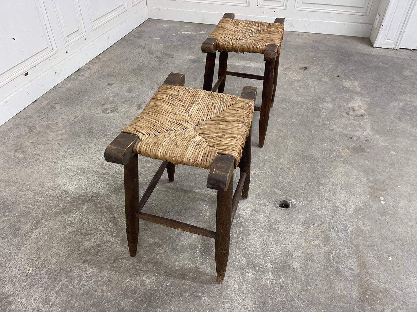 A pair of 1950s straw stools.