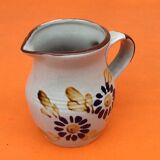 Glazed ceramic pitcher floral decoration