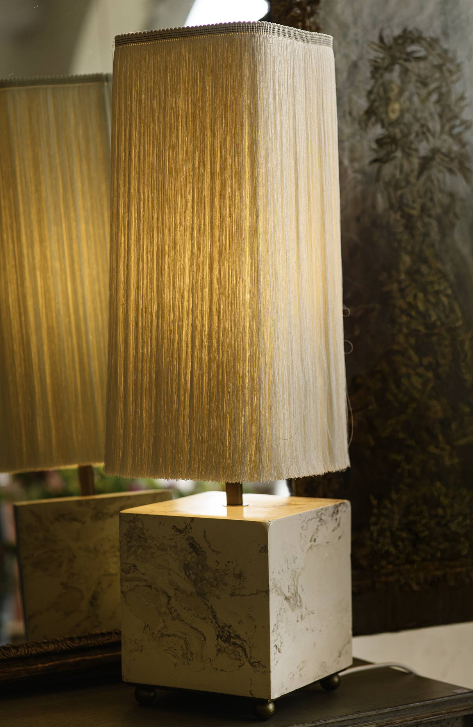 Beige marble stucco base, Houles white ecru fringed lampshade.
