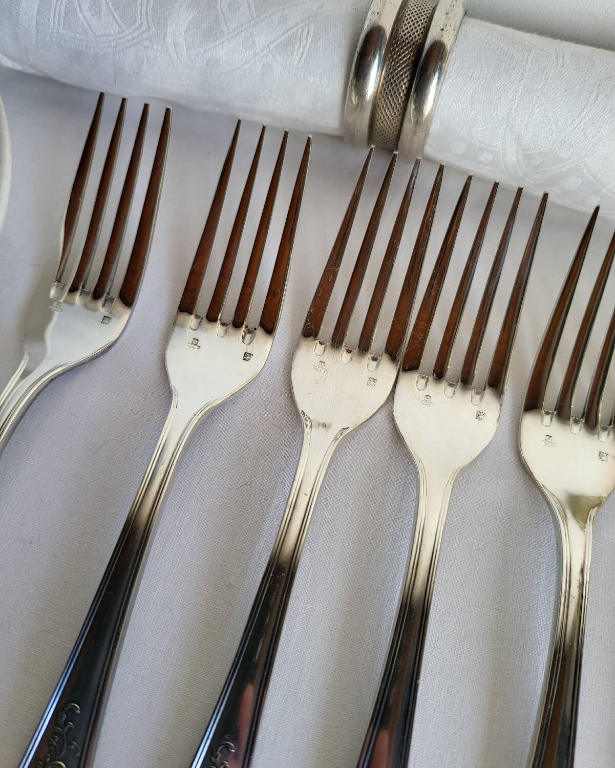12 large silver-plated metal table forks by Guildart