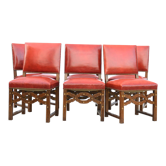 6 red leather chairs