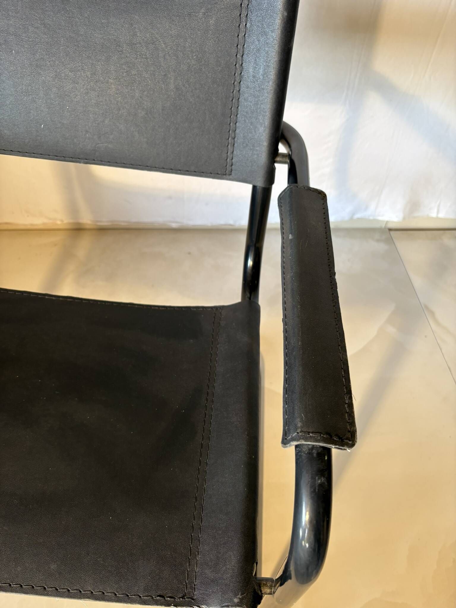 Set of 12 vintage black leather and tubular steel chairs – Italy, year