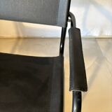 Set of 12 vintage chairs in black leather and tubular steel – Italy, 1970s