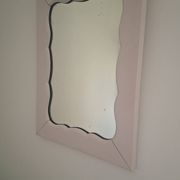 Mid-20th century rectangular wall mirror with a powder pink frame.