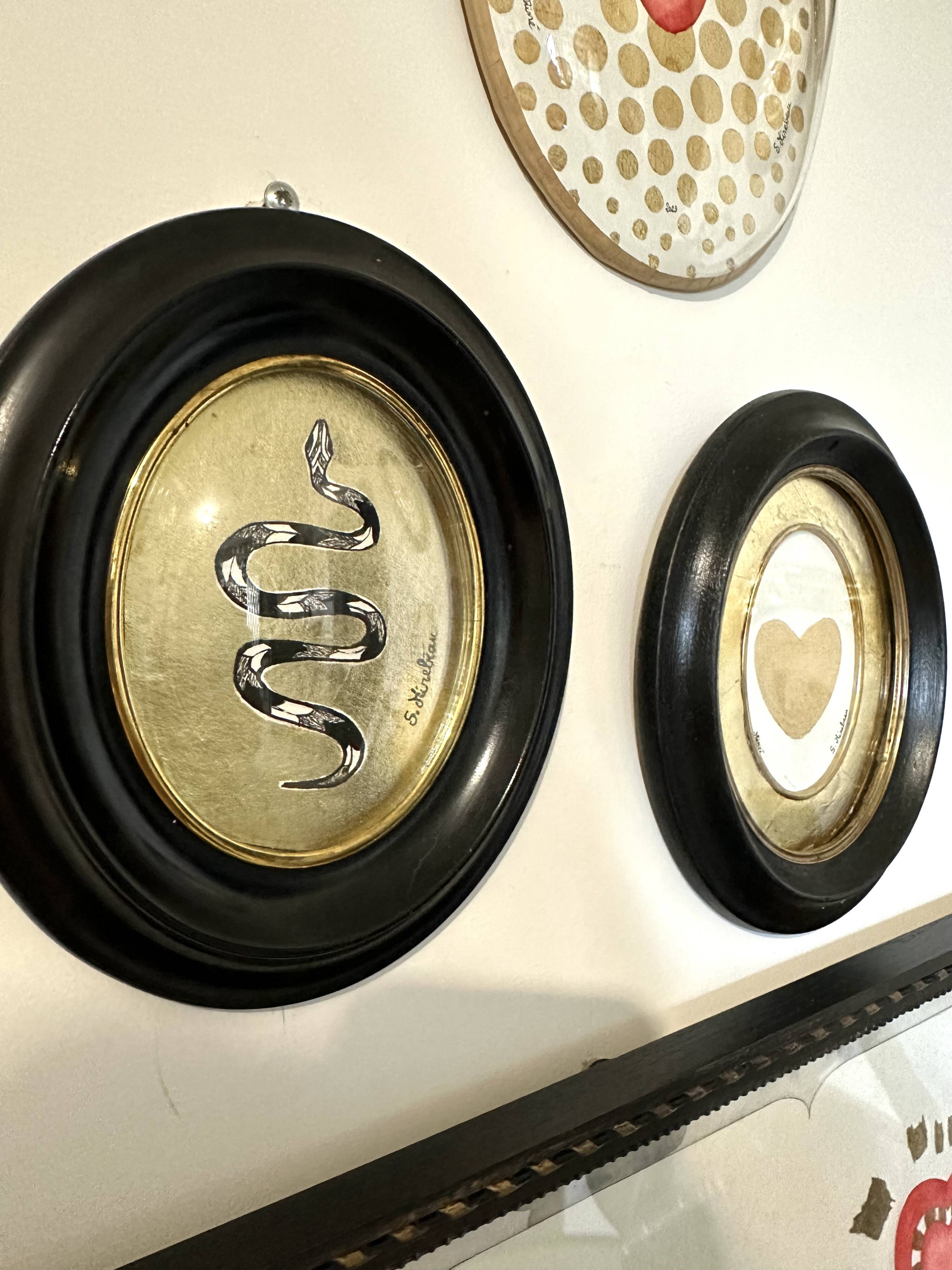 Curved glass snake frame