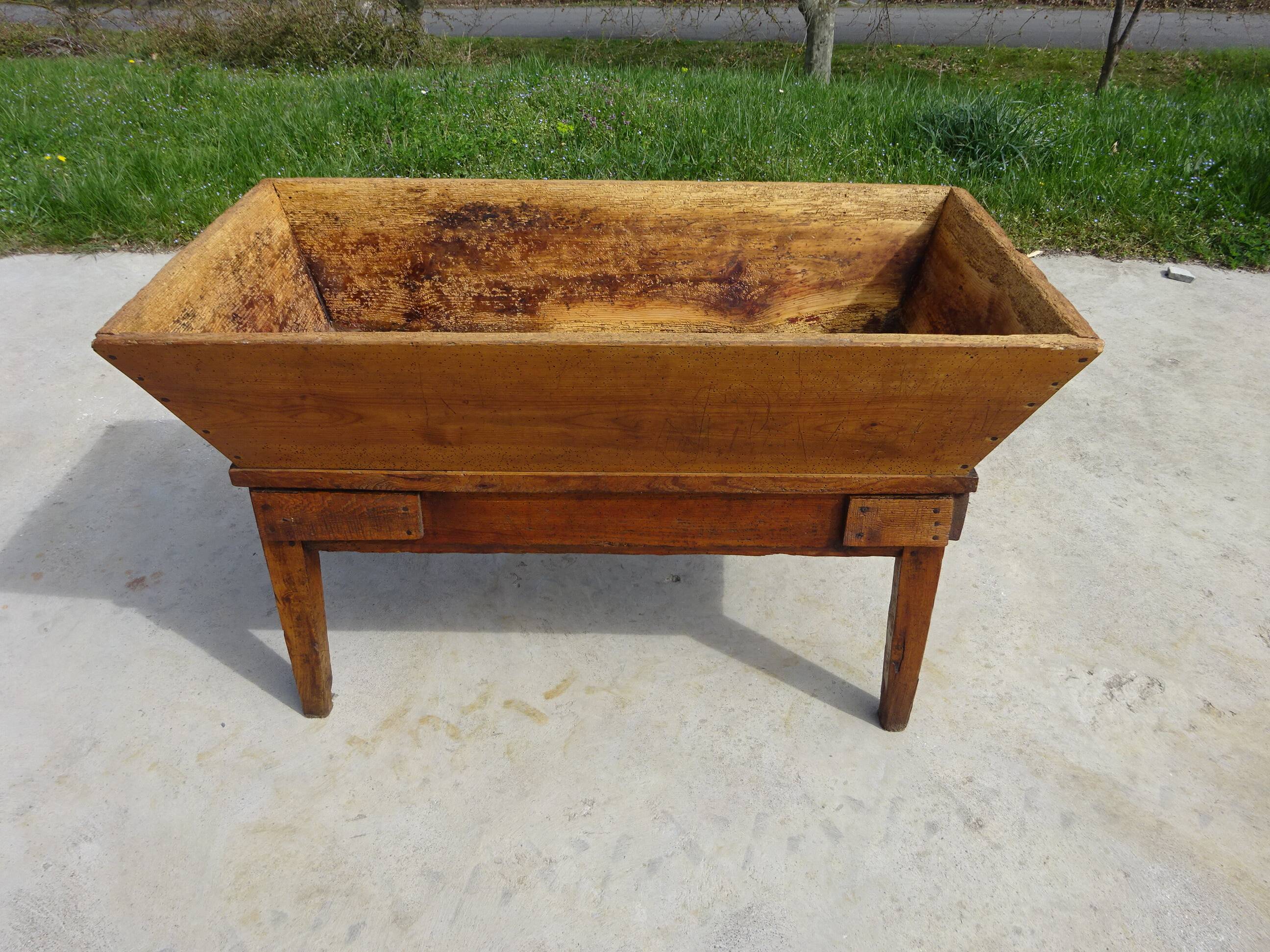Very old solid oak dough trough with a lid and removable legs.