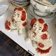 Pair of red Cavalier King Charles dogs in Staffordshire pottery, 19th century.