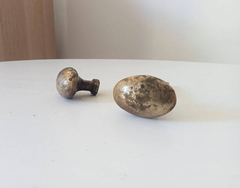 Pair of antique oval door handles in solid gold-plated brass.