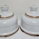 Four white enamelled metal cheese bells early twentieth century