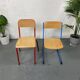 Set of 2 mismatched industrial school chairs