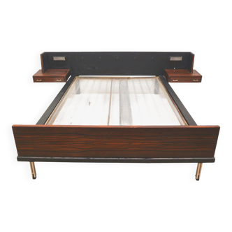 Vintage double bed with floating bedside tables and lighting from the 60s
