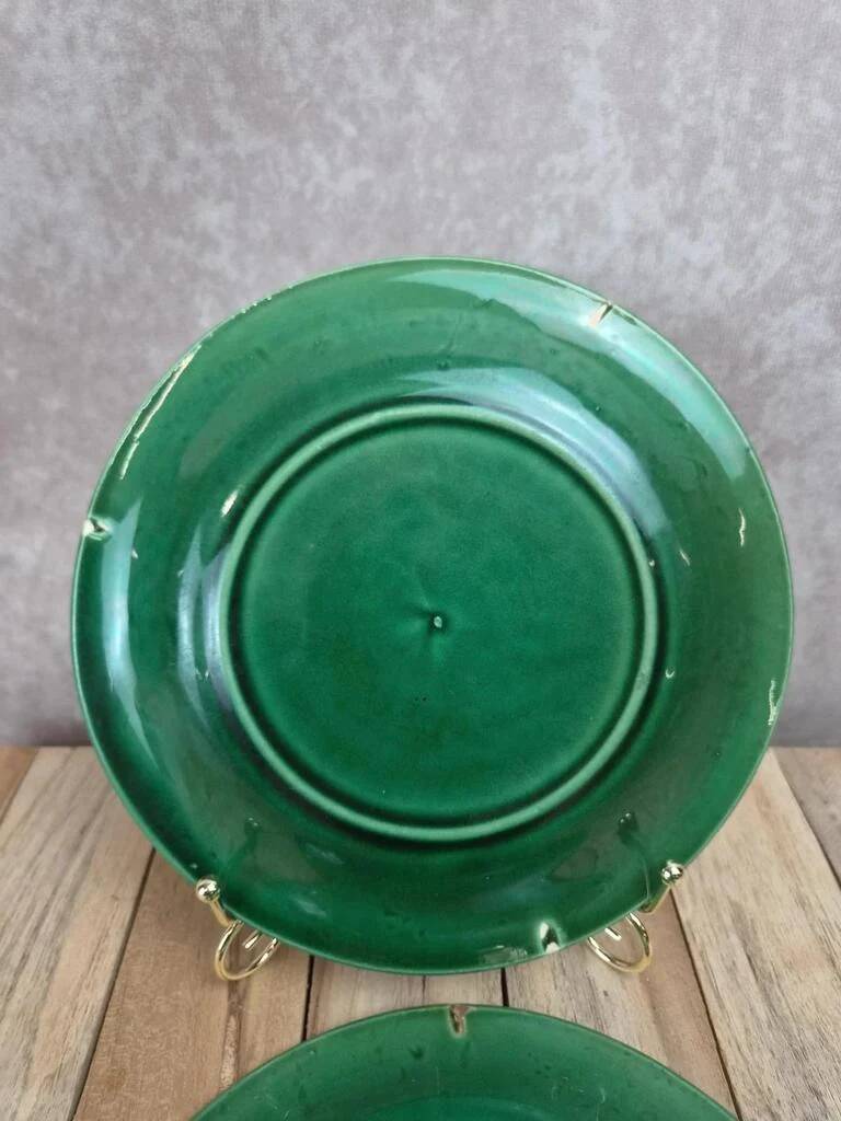 Set of 2 green earthenware dessert plates with vine decoration.