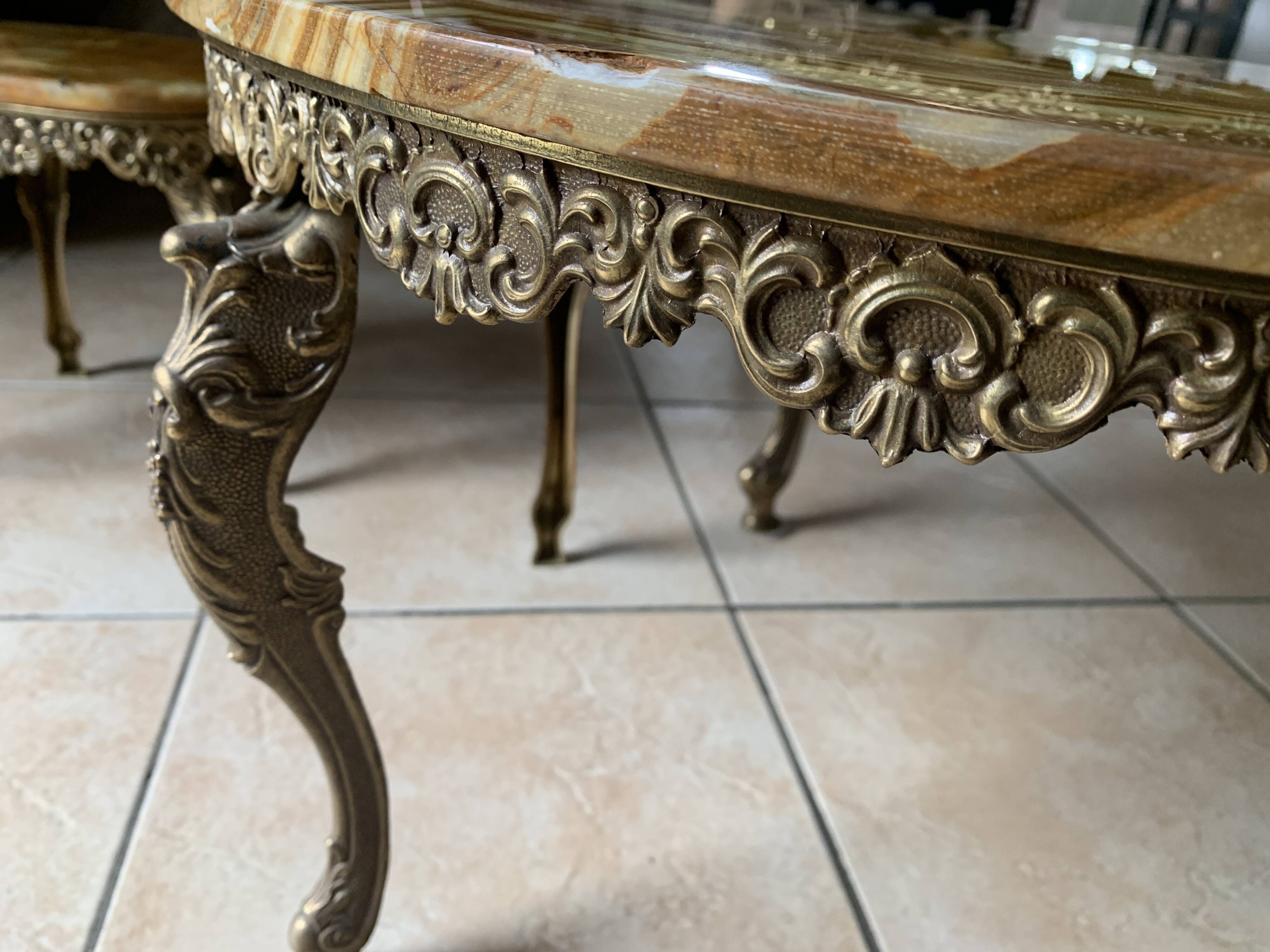 Lot of 3 marble and brass nesting tables.