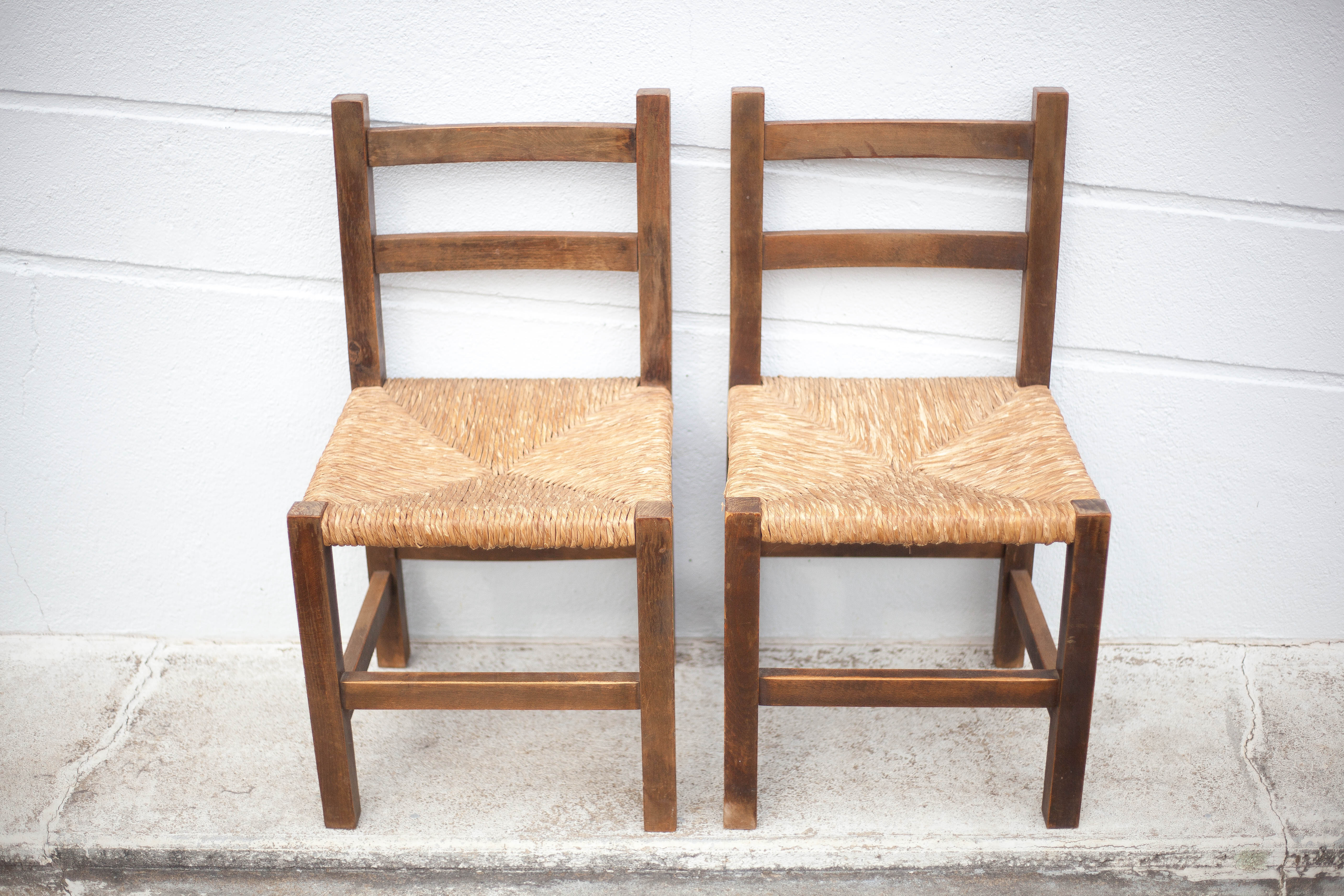 Pair of wooden and straw chairs