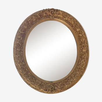 Miroir ovale 19 eme en bois et stuc doré