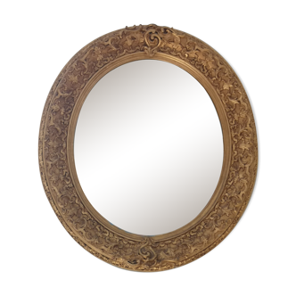 Oval mirror 19 eme in wood and gilded stucco