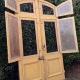Porte d'entrée cintrée double en chêne, grilles et verre, XIXème