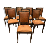 Suite de 8 chaises en bois teinté assise et dossier en cuir fauve années 1970