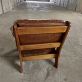 Armchairs in leather and vintage wood 70's