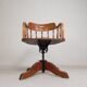 Oak office chair with a spring system and height adjustable, 1930s.