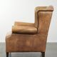 Comfortable cowhide wingback armchair with a timeless English look