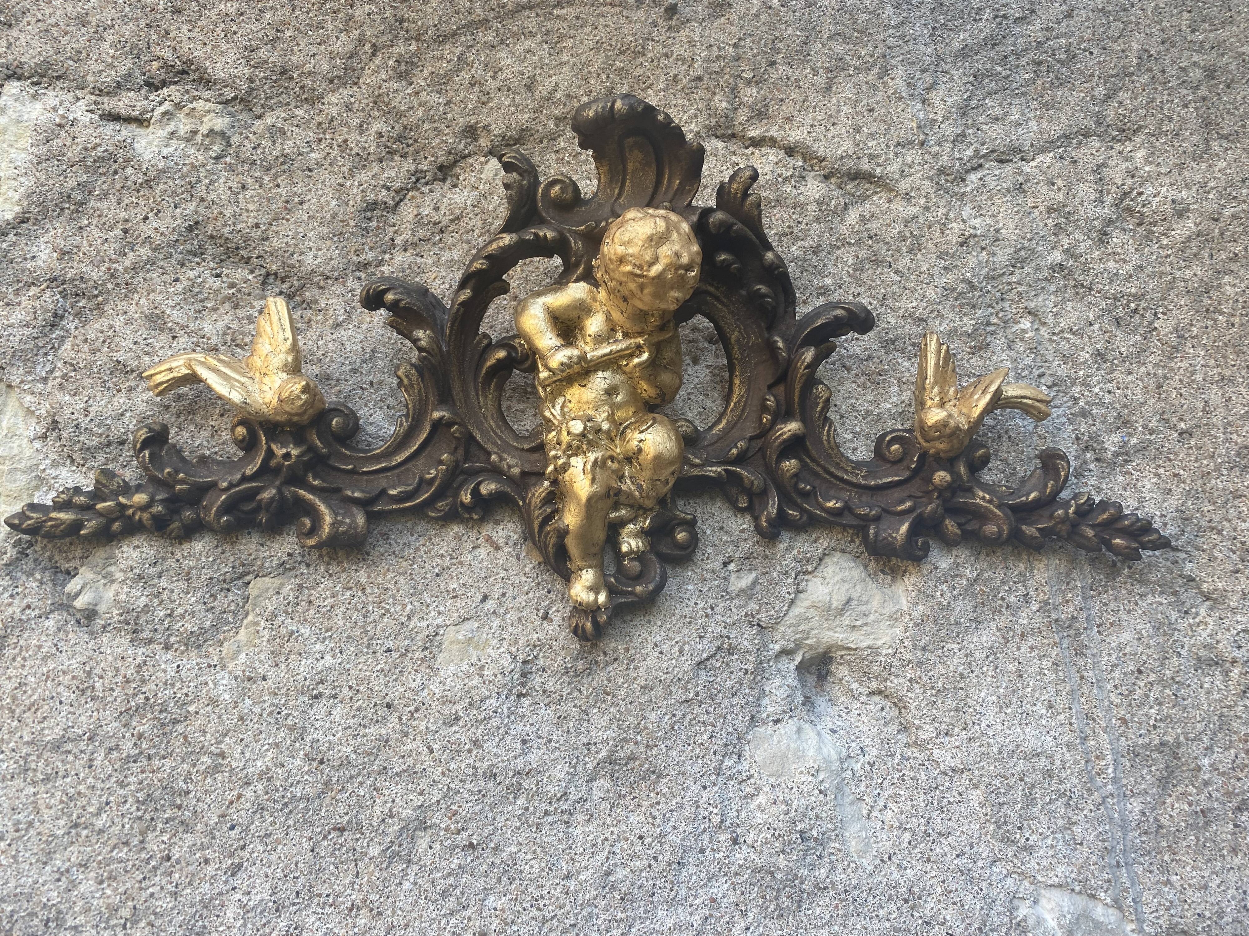 Pediment cherub musician