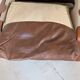Leather and wood armchair, brutalist style.