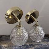 Pair of chiseled globe wall lights