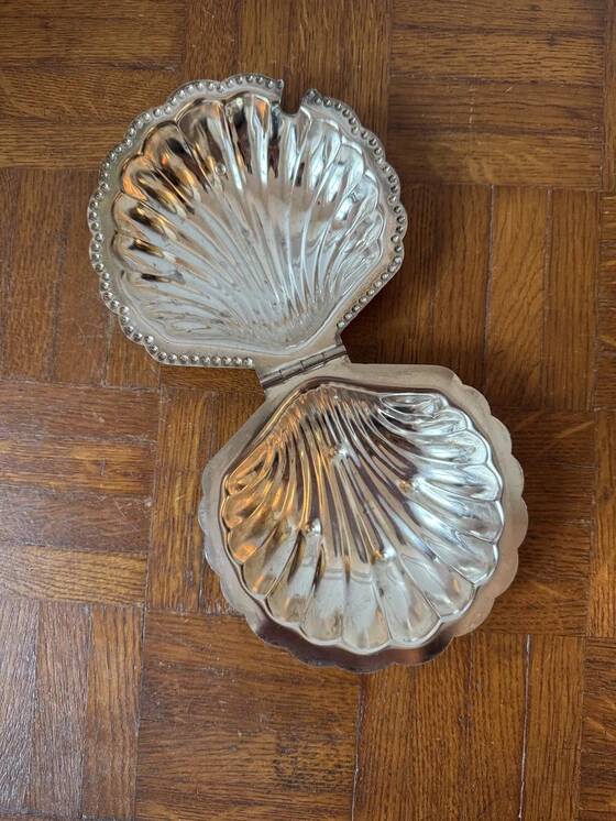 Antique silver-plated metal butter dish in the shape of a seashell
