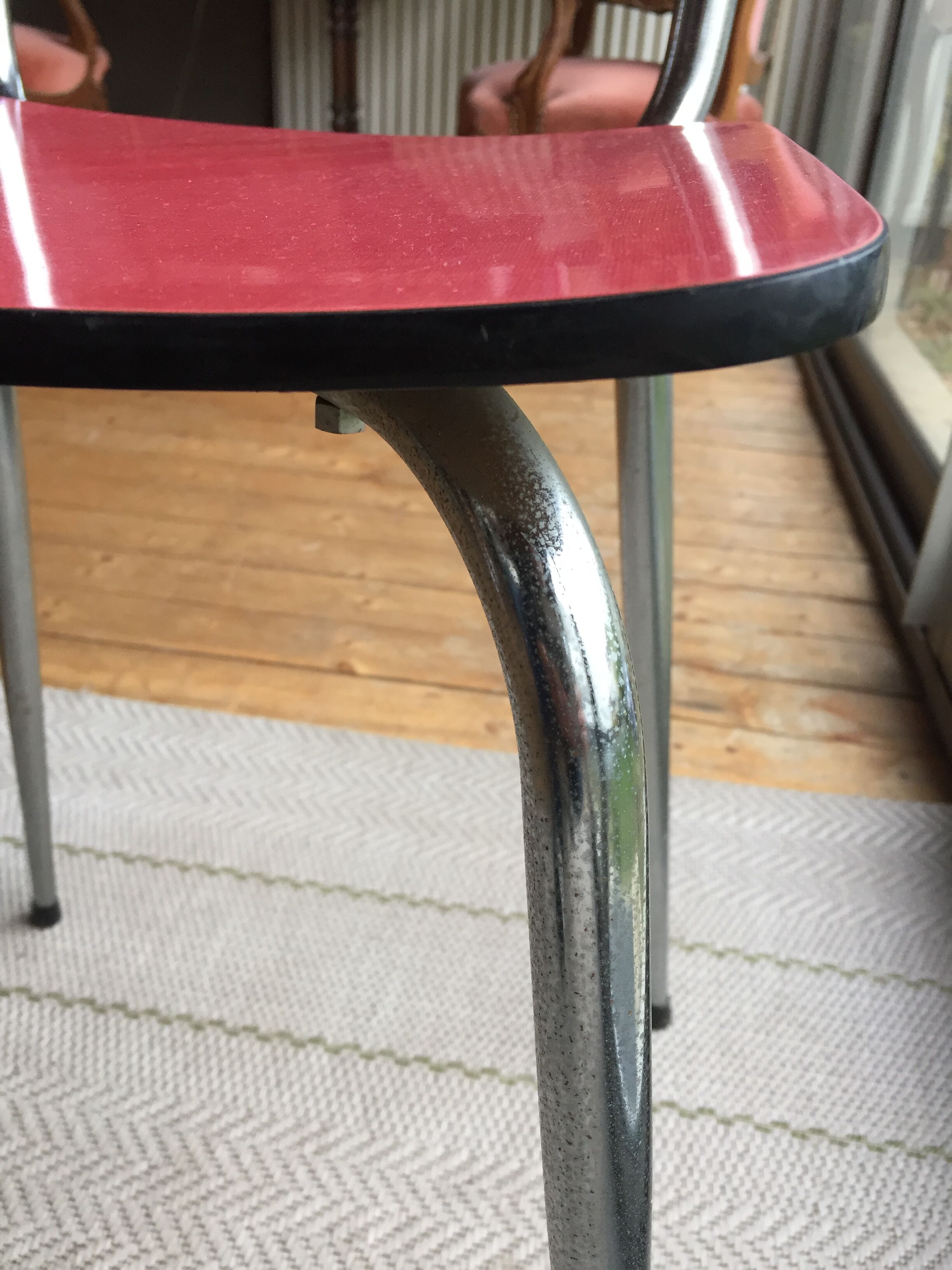 Table set and 2 vintage vintage pale red formica chairs