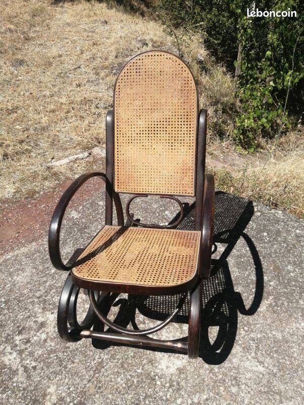 Vintage Thonet rocking chair in cane and bent wood.
