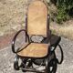 Vintage Thonet rocking chair in cane and bent wood.