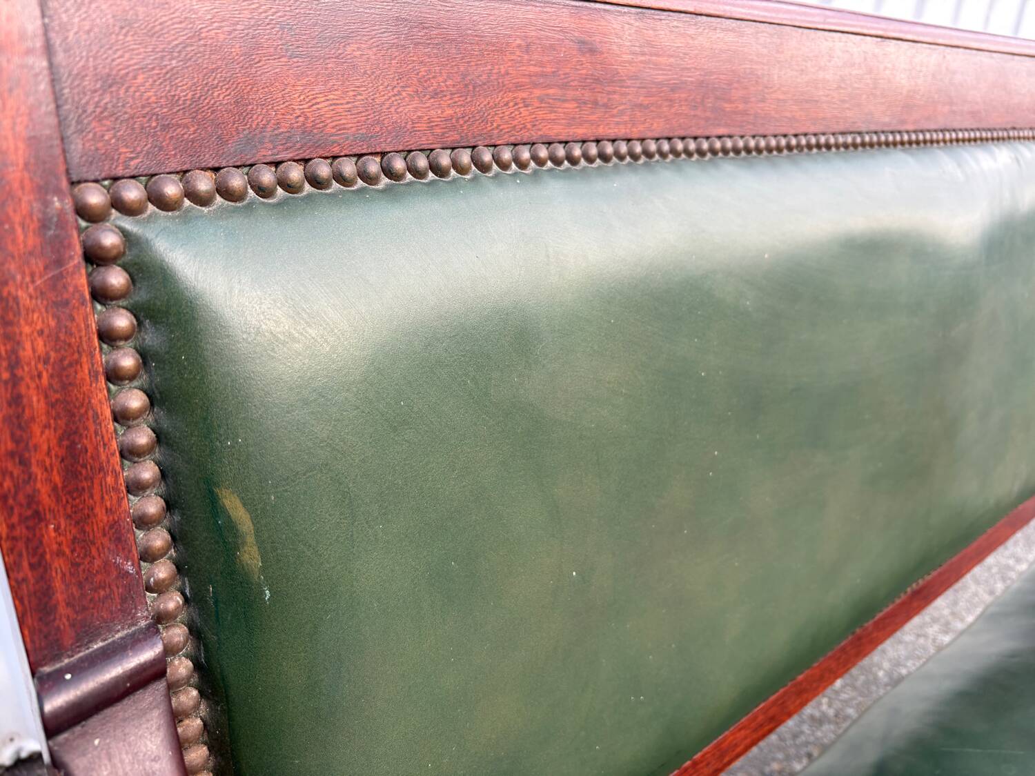 Empire style bench in mahogany and green leather