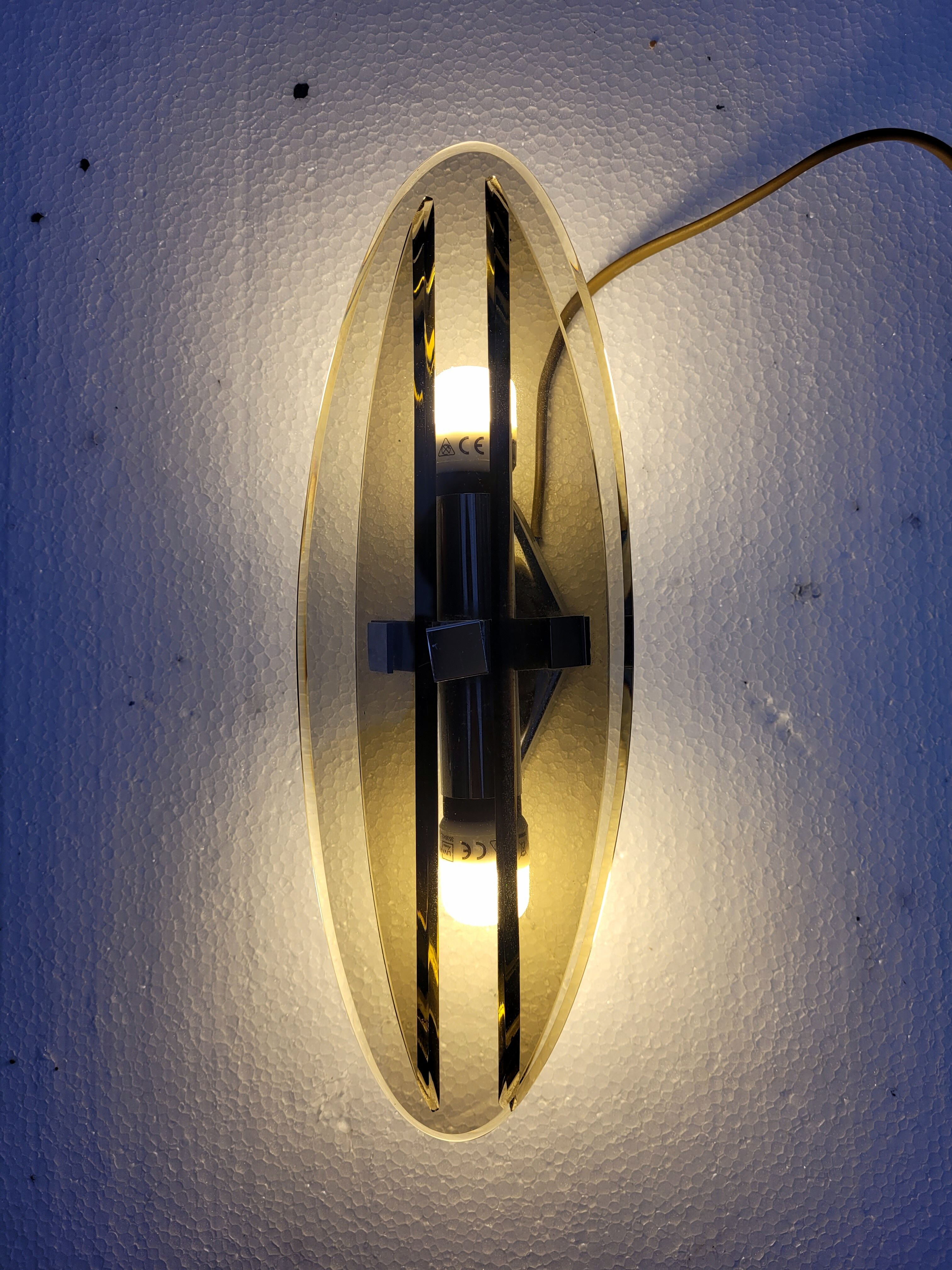 Pair of elliptical italian wall lamps in smoked glass and chrome veca