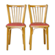 Pair of red Baumann skai chairs 1960