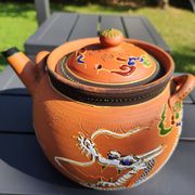 Antique decorative Japanese teapot in terracotta orange tones, with multico enamelled dragon decoration