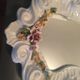 Mirror porcelain contained flowers, signed "Bassano"