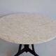 Mid-century modern round dining table in marble and ebony wood.