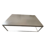 Coffee table in stone and brushed steel