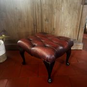Red leather footrest in Chesterfield style, vintage 1970s.