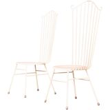 Two white metal chairs